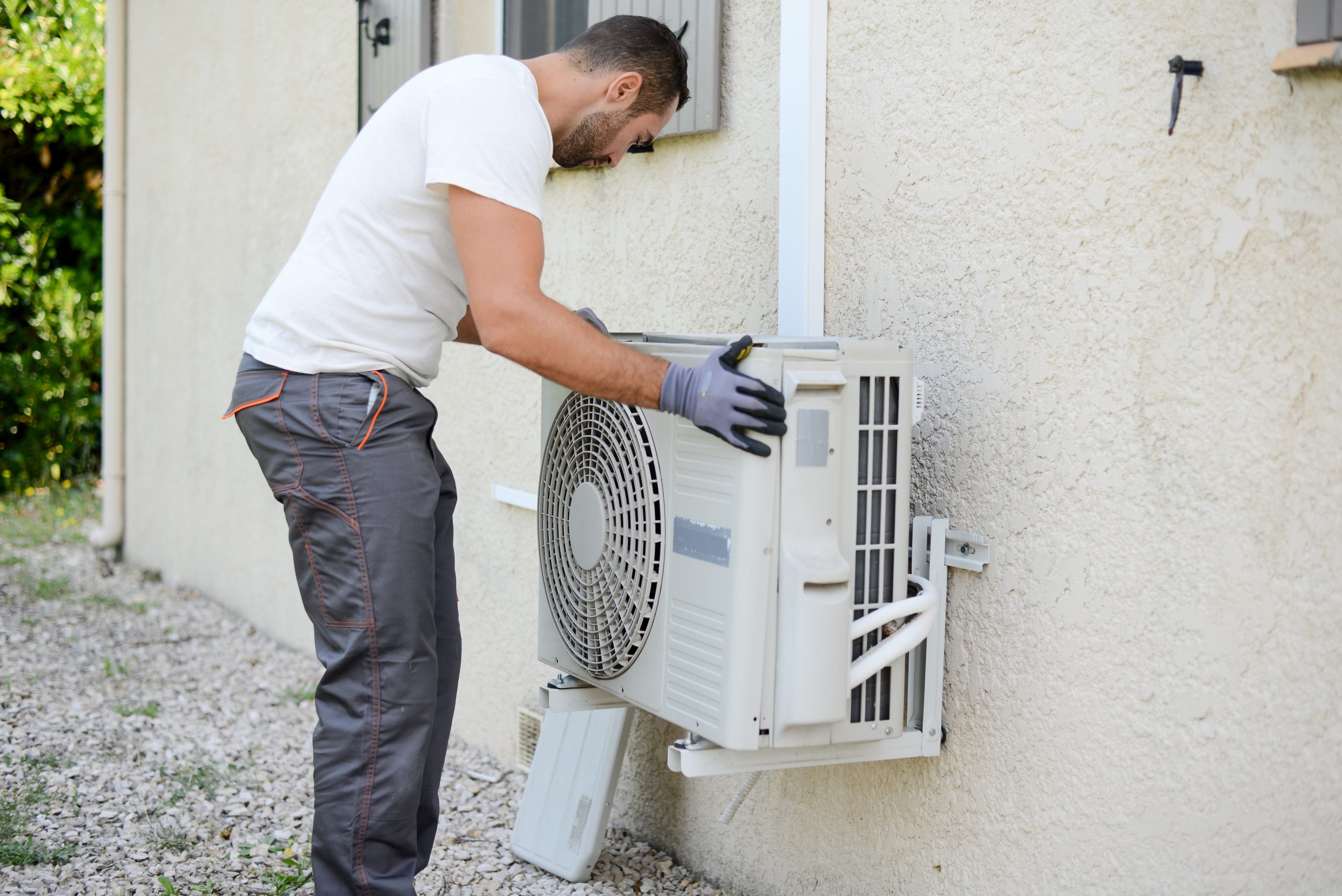 contractor performing hvac service on private house