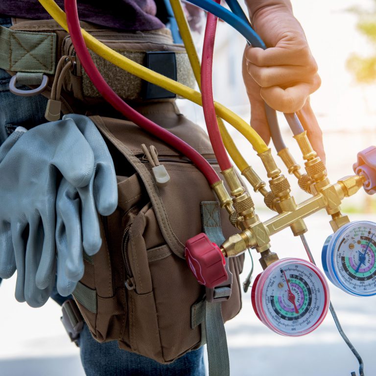 hvac contractor with pressure lines going to work