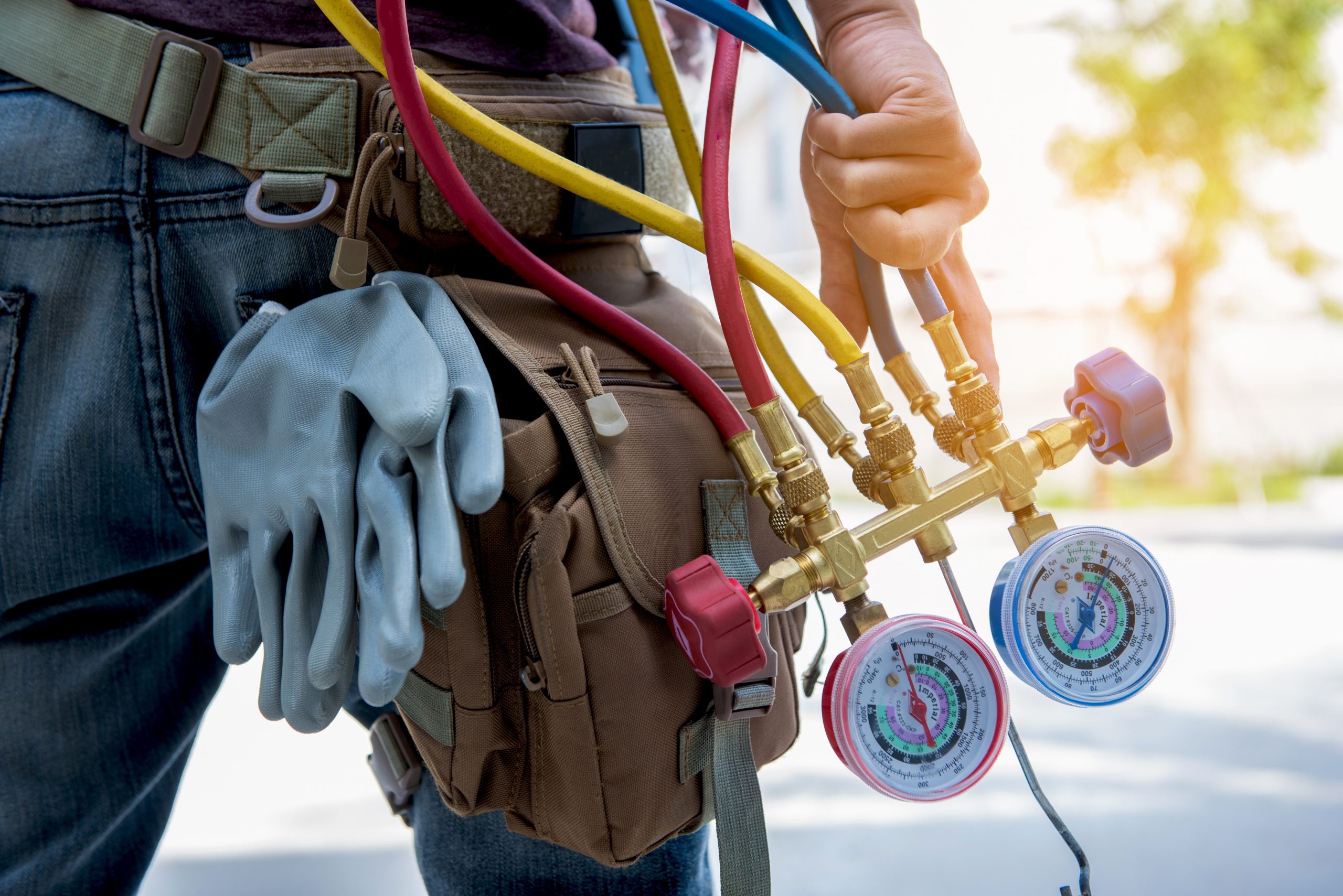 hvac contractor with pressure lines going to work